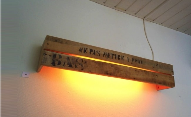 simple pallet parts on the wall used as a lampshade
