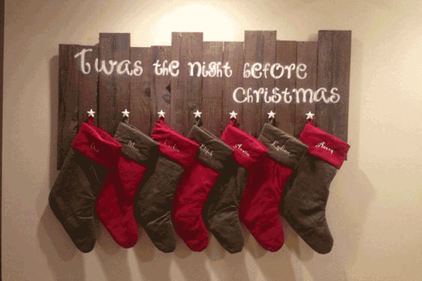 Christmas stockings on a pallet board