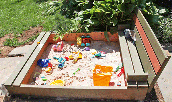 pallet sandpit with toys inside