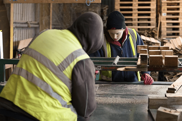 two professionals working on pallet repair at Universal cPallets