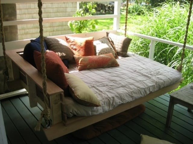Pallet swing bed on a porch