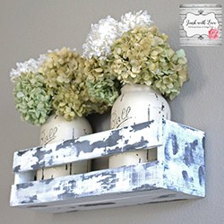 rustic chic window box with jars or flowers in it