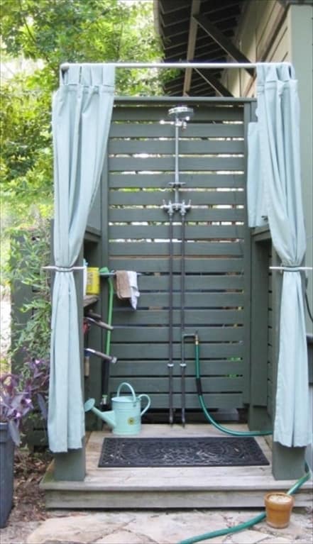 painted outdoor pallet shower with curtains